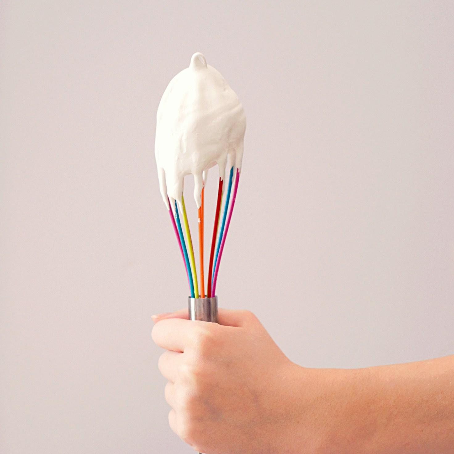 Community members collaborating in a modern kitchen space, sharing recipes and cooking techniques